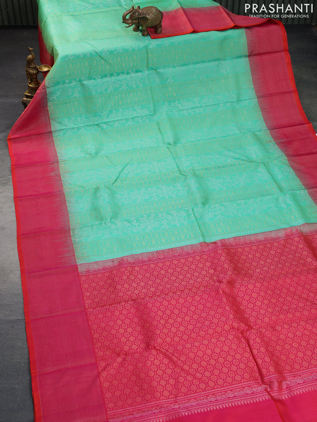 Pure soft silk saree teal green shade and dual shade of pinkish orange with allover silver & gold zari weaves and long zari woven border