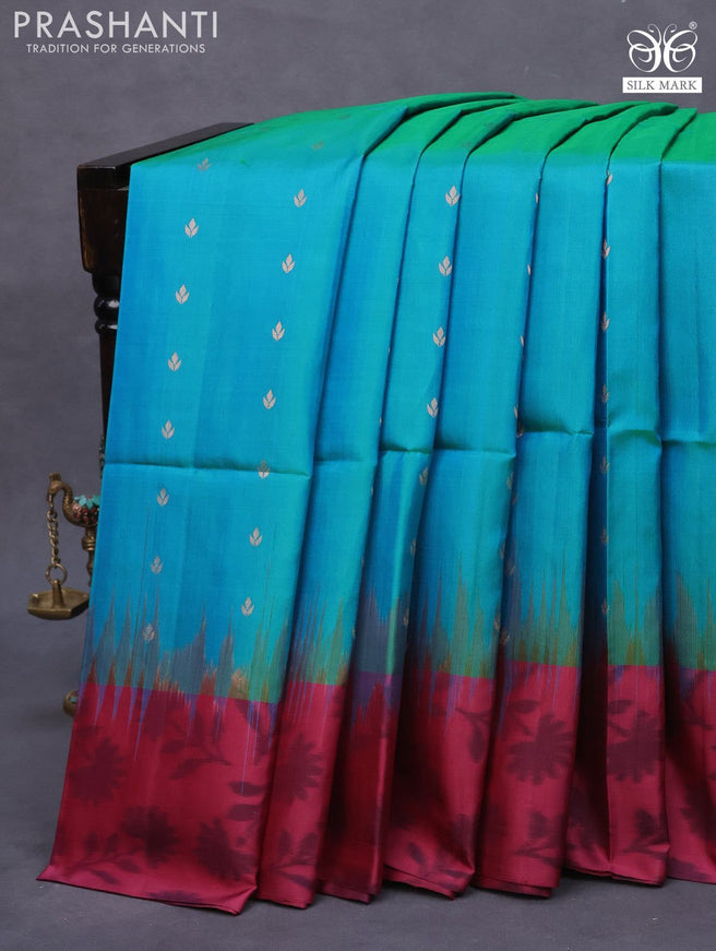 Pure soft silk saree dual shade of bluish green and maroon with allover zari woven buttas and ikat style border