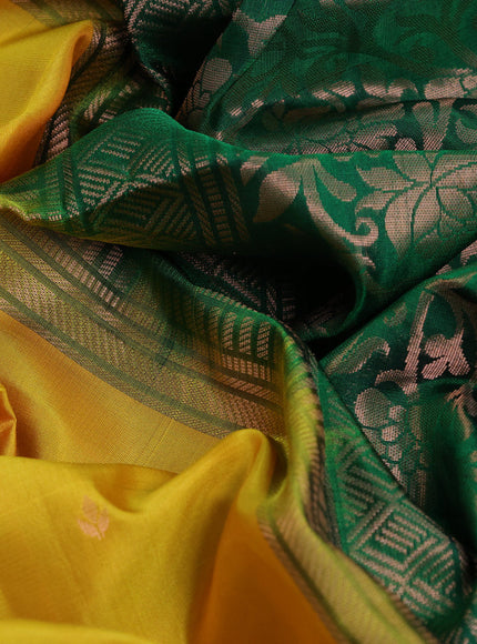 Pure soft silk saree yellow and green with allover zari woven buttas and ikat style border