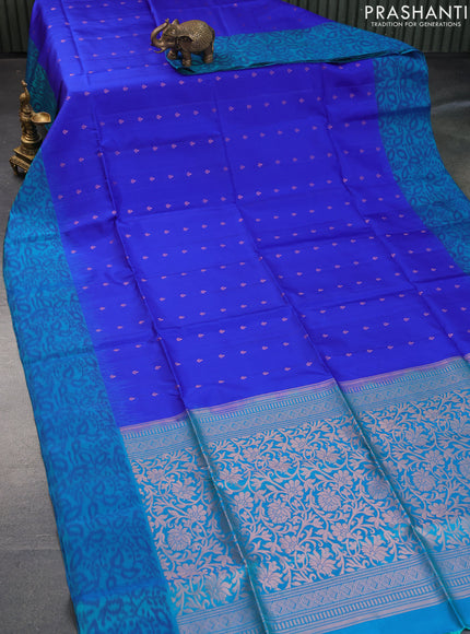 Pure soft silk saree royal blue and dual shade of teal bluish green with allover zari woven buttas and ikat style border