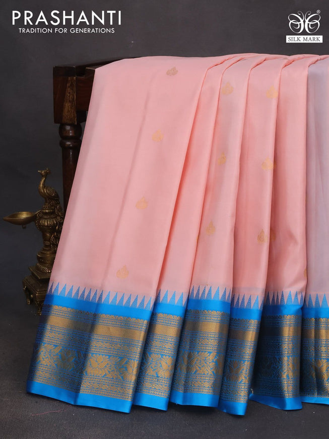 Pure gadwal silk saree peach pink and cs blue with zari woven buttas and temple deisgn zari woven border