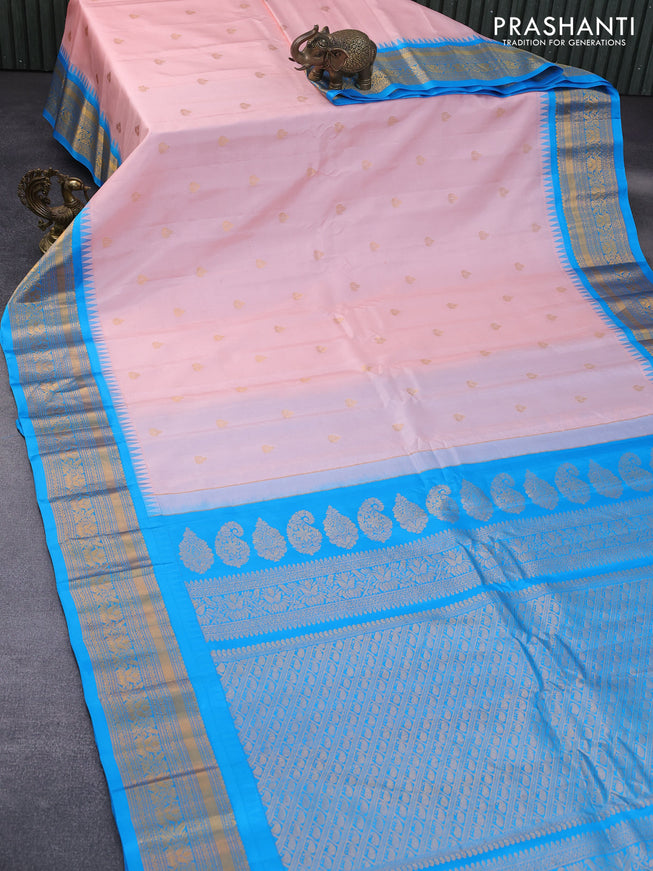 Pure gadwal silk saree peach pink and cs blue with zari woven buttas and temple deisgn zari woven border