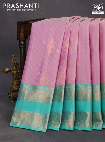 Pure gadwal silk saree mild purple and teal green shade with allover zari weaves and rettapet zari woven border