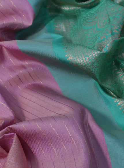 Pure gadwal silk saree mild purple and teal green shade with allover zari weaves and rettapet zari woven border