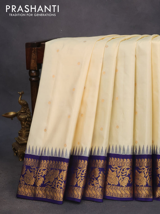 Pure gadwal silk saree cream and dark blue with zari woven buttas and temple deisgn zari woven border