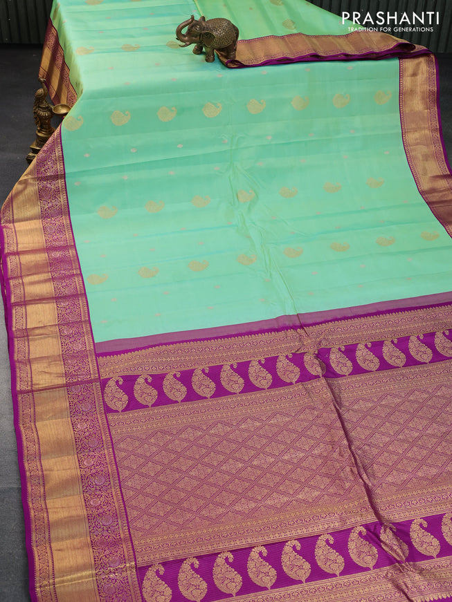 Pure gadwal silk saree teal green shade and purple with zari woven buttas and zari woven border