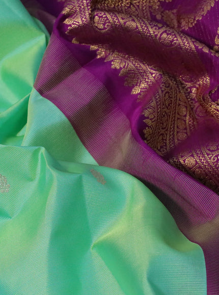 Pure gadwal silk saree teal green shade and purple with zari woven buttas and zari woven border