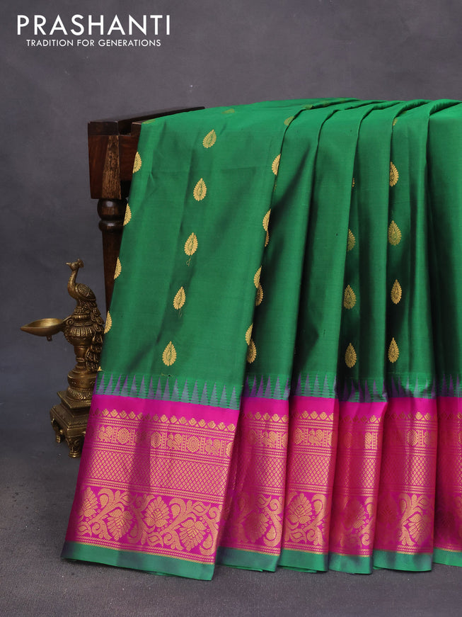 Pure gadwal silk saree green and magenta pink with zari woven buttas and temple deisgn zari woven border