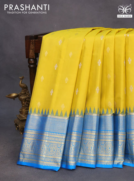 Pure gadwal silk saree lime yellow and cs blue with zari woven buttas and temple deisgn zari woven border