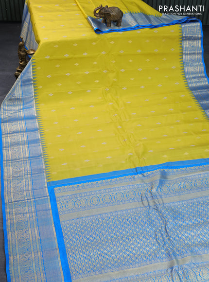 Pure gadwal silk saree lime yellow and cs blue with zari woven buttas and temple deisgn zari woven border