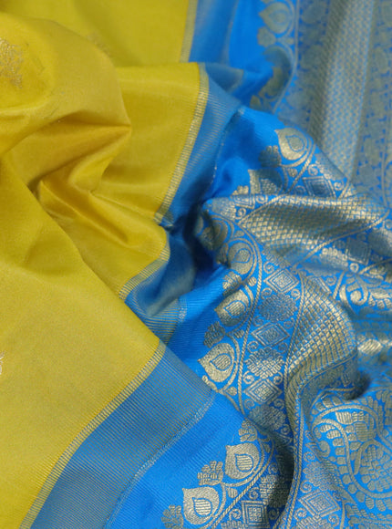 Pure gadwal silk saree lime yellow and cs blue with zari woven buttas and temple deisgn zari woven border