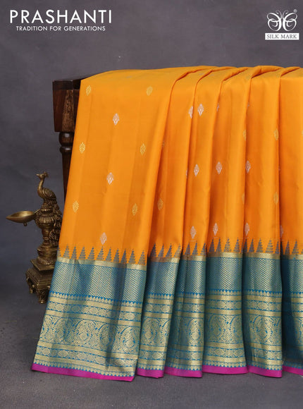 Pure gadwal silk saree mustard yellow and teal blue with zari woven buttas and temple deisgn zari woven border