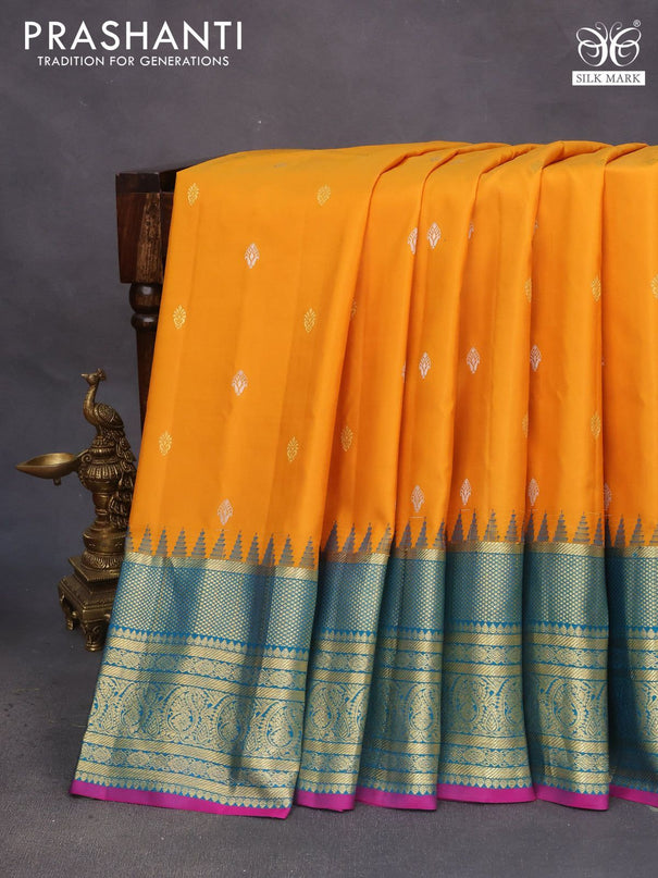 Pure gadwal silk saree mustard yellow and teal blue with zari woven buttas and temple deisgn zari woven border