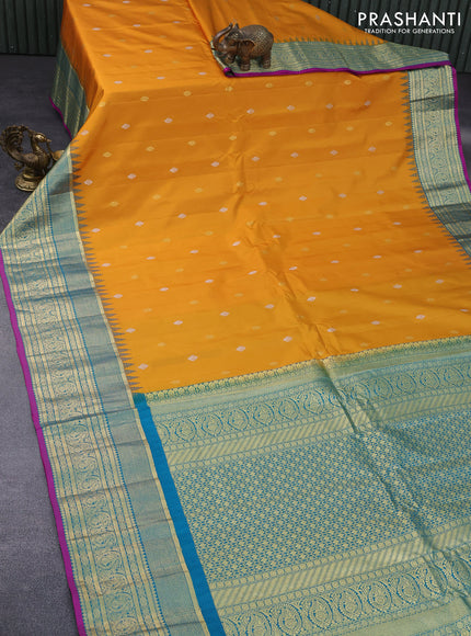 Pure gadwal silk saree mustard yellow and teal blue with zari woven buttas and temple deisgn zari woven border