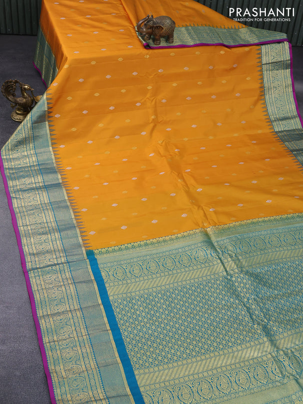 Pure gadwal silk saree mustard yellow and teal blue with zari woven buttas and temple deisgn zari woven border