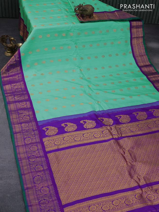 Pure gadwal silk saree teal green shade and purple with zari woven buttas and temple deisgn zari woven border