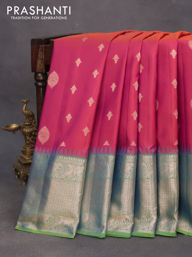 Pure gadwal silk saree dual shade of pinkish orange and light green with zari woven buttas and temple deisgn zari woven border