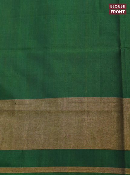 Rajkot patola silk saree dual shade of mustard yellowish pink and bottle green red with allover ikat weaves and ikat woven zari border