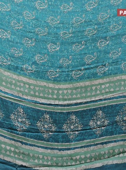 Semi modal saree teal green with allover prints and printed border