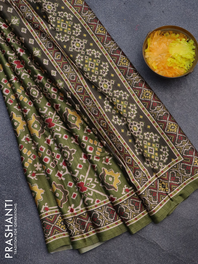 Semi modal saree green with allover patola prints and printed border