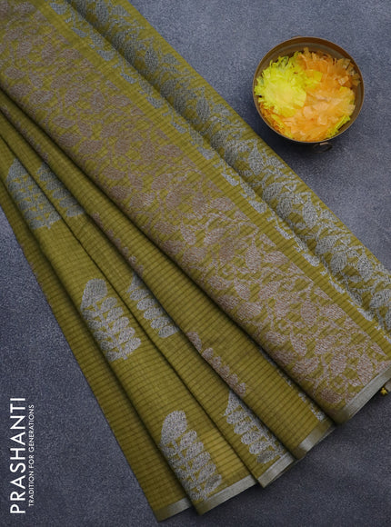 Matka tussar saree mehendi green with thread & silver zari woven buttas and piping border