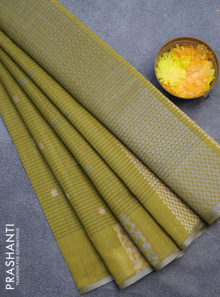 Matka tussar saree mehendi green with zari woven buttas and piping border