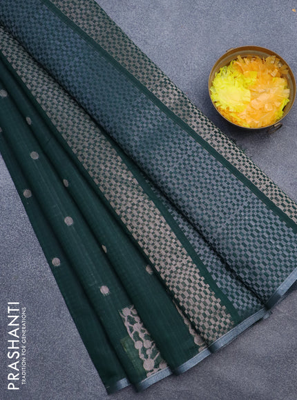 Matka tussar saree dark green with zari woven buttas and piping border