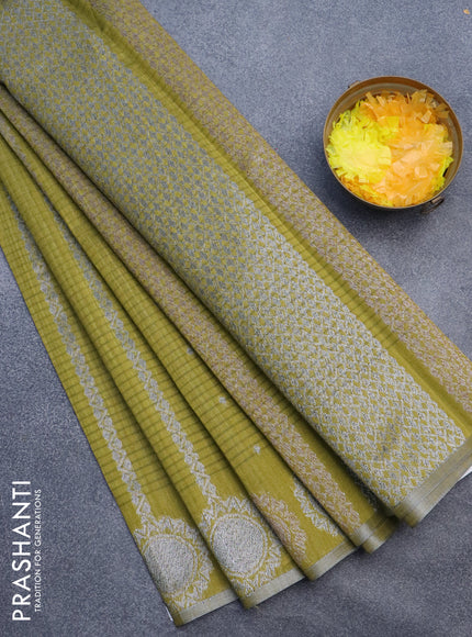 Matka tussar saree mehendi green with allover thread & silver zari weaves and piping border