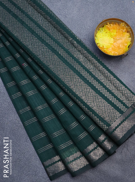 Matka tussar saree dark green with allover zari weaves and zari woven border