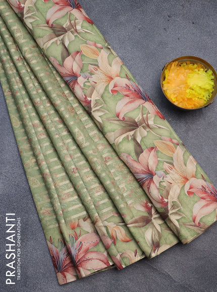 Semi tussar saree green shade with allover zari woven veldhari design & prints and floral printed border