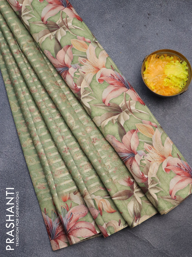 Semi tussar saree green shade with allover zari woven veldhari design & prints and floral printed border