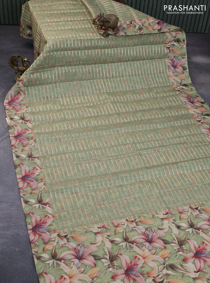 Semi tussar saree green shade with allover zari woven veldhari design & prints and floral printed border