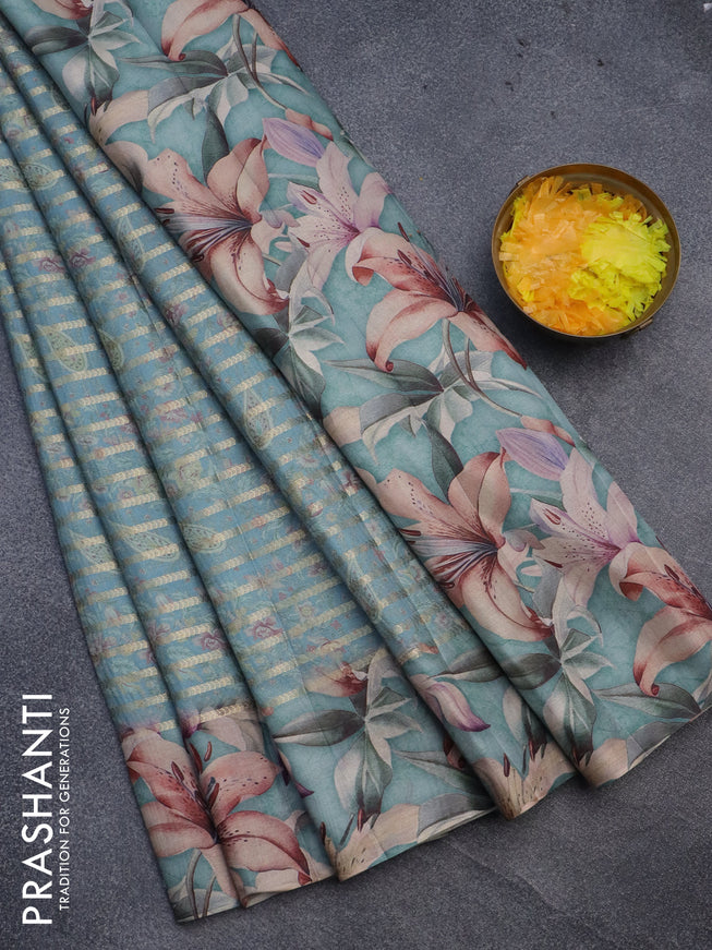 Semi tussar saree pastel blue shade with allover zari woven veldhari design & prints and floral printed border