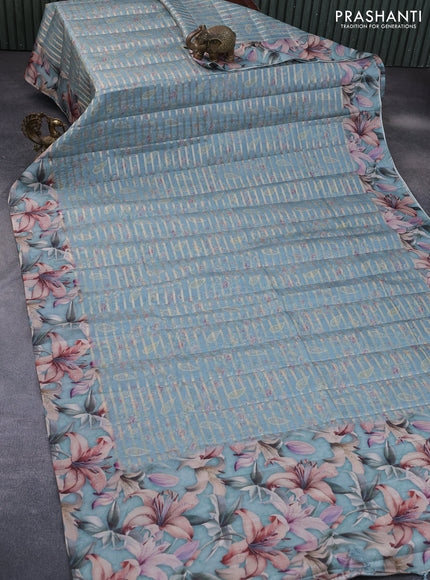 Semi tussar saree pastel blue shade with allover zari woven veldhari design & prints and floral printed border