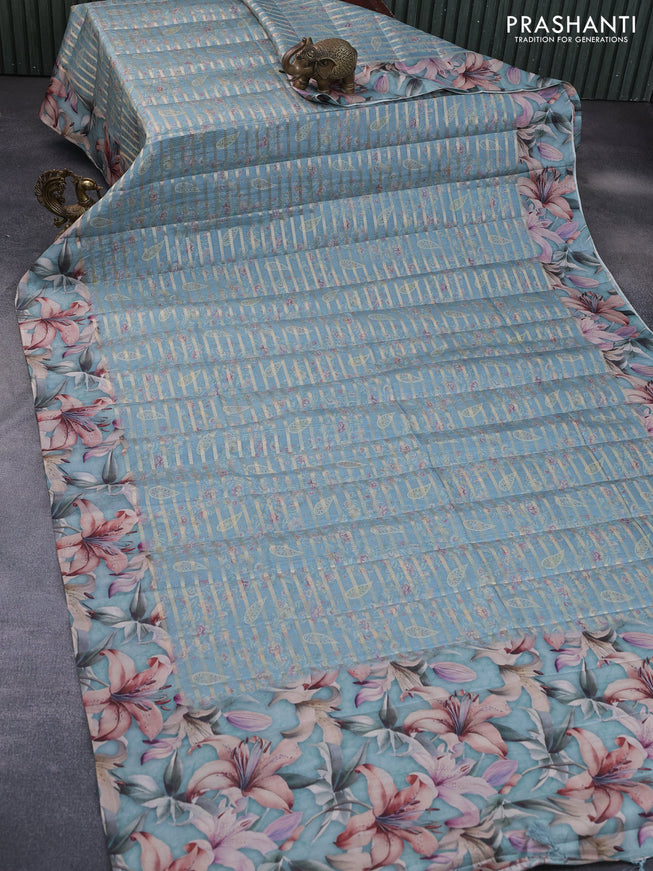 Semi tussar saree pastel blue shade with allover zari woven veldhari design & prints and floral printed border