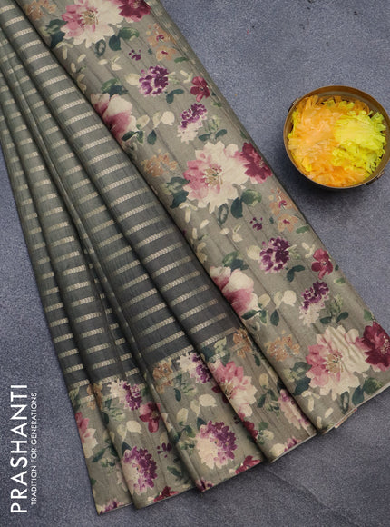 Semi tussar saree dark sap green and elaichi green with allover zari woven veldhari design and floral printed border