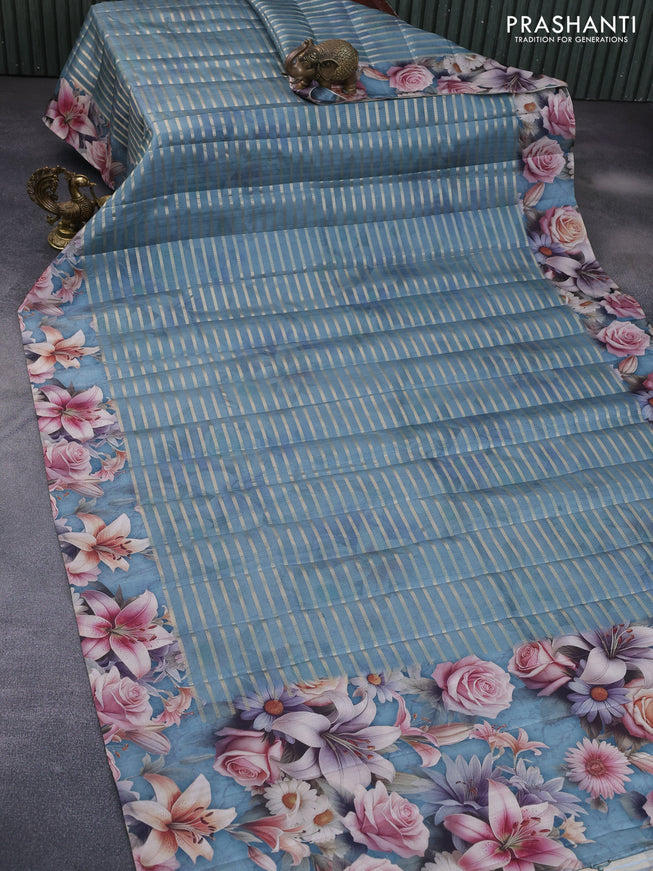 Semi tussar saree greyish blue with allover zari woven veldhari design and floral printed border