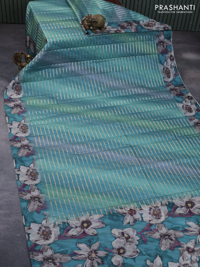 Semi tussar saree teal green with allover zari woven veldhari design and floral printed border