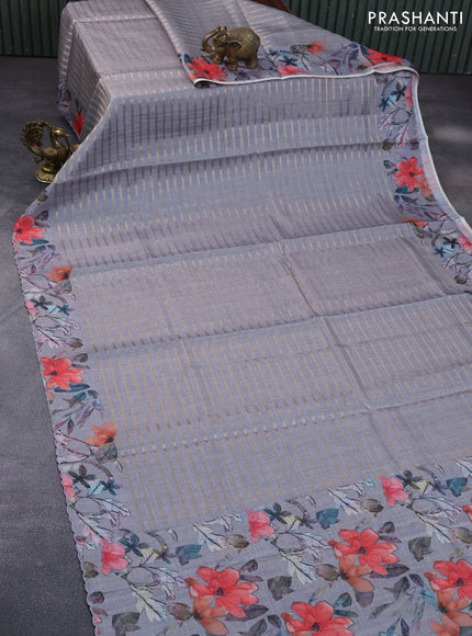 Semi tussar saree grey with allover zari woven veldhari design and floral printed border