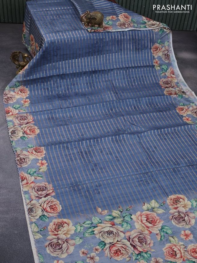 Semi tussar saree blue shade with allover zari woven veldhari design and floral printed border