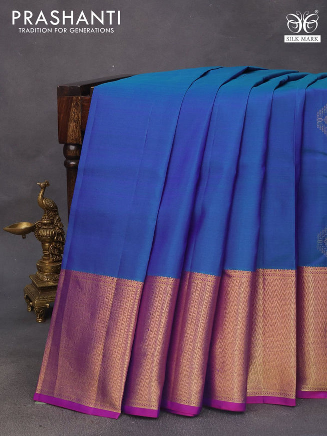 Pure kanchipuram silk saree dual shade of bluish green and purple with zari woven buttas and zari woven border