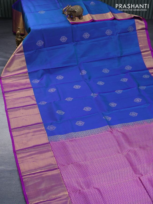 Pure kanchipuram silk saree dual shade of bluish green and purple with zari woven buttas and zari woven border