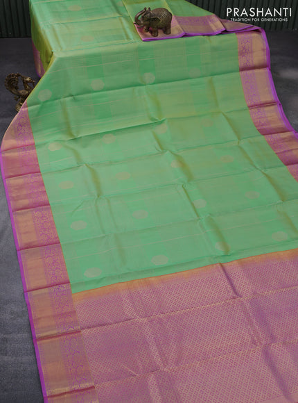 Pure kanchipuram silk saree green shade and purple with allover zari weaves & buttas and zari woven border