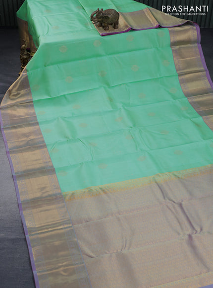 Pure kanchipuram silk saree teal green shade and pink shade with allover zari weaves and zari woven border