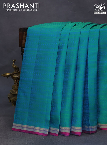 Pure kanchipuram silk saree dual shade of teal green and pink with allover self emboss and zari woven border