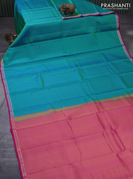 Pure kanchipuram silk saree dual shade of teal green and pink with allover self emboss and zari woven border