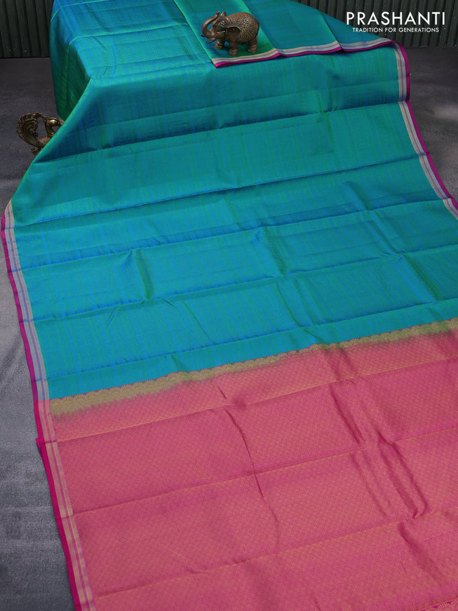 Pure kanchipuram silk saree dual shade of teal green and pink with allover self emboss and zari woven border