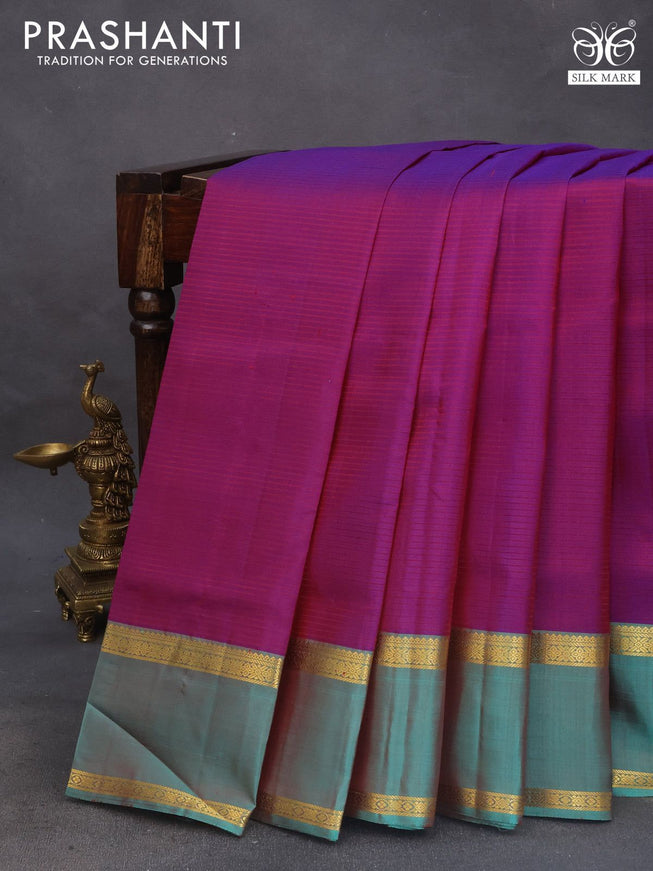 Pure kanchipuram silk saree purple and teal green with allover stripes pattern and rettapet zari woven border