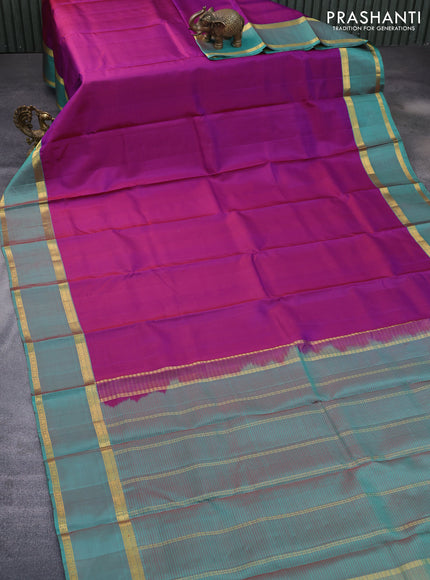 Pure kanchipuram silk saree purple and teal green with allover stripes pattern and rettapet zari woven border