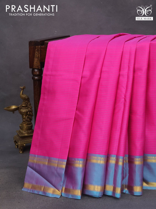 Pure kanchipuram silk saree pink and dual shade of teal blue with allover stripes pattern and rettapet zari woven border